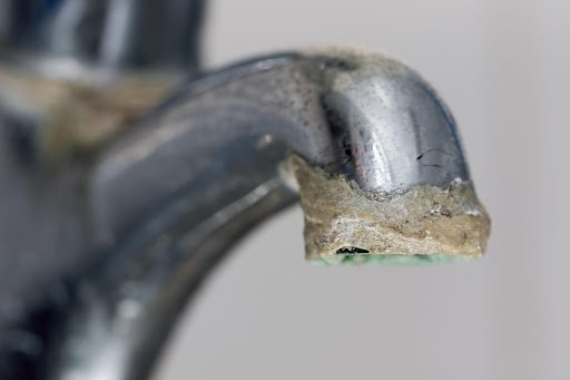 a faucet with calcium buildup